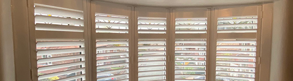 curved bay shutters installed on a window