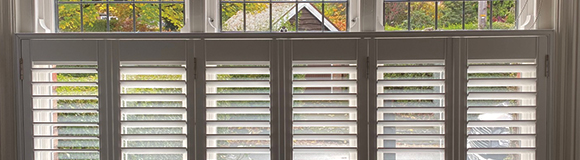 six bifold shutters installed onto a long window